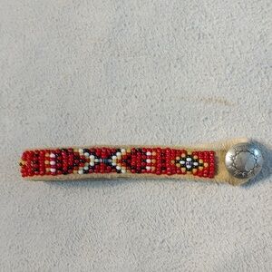 Handmade beaded bracelet 8" red white black  and yellow silver button